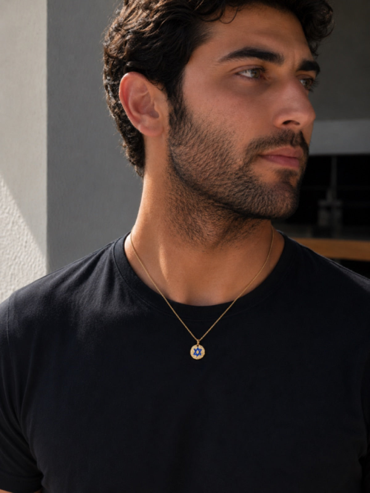 Round Star Of Israel tag — gold on model